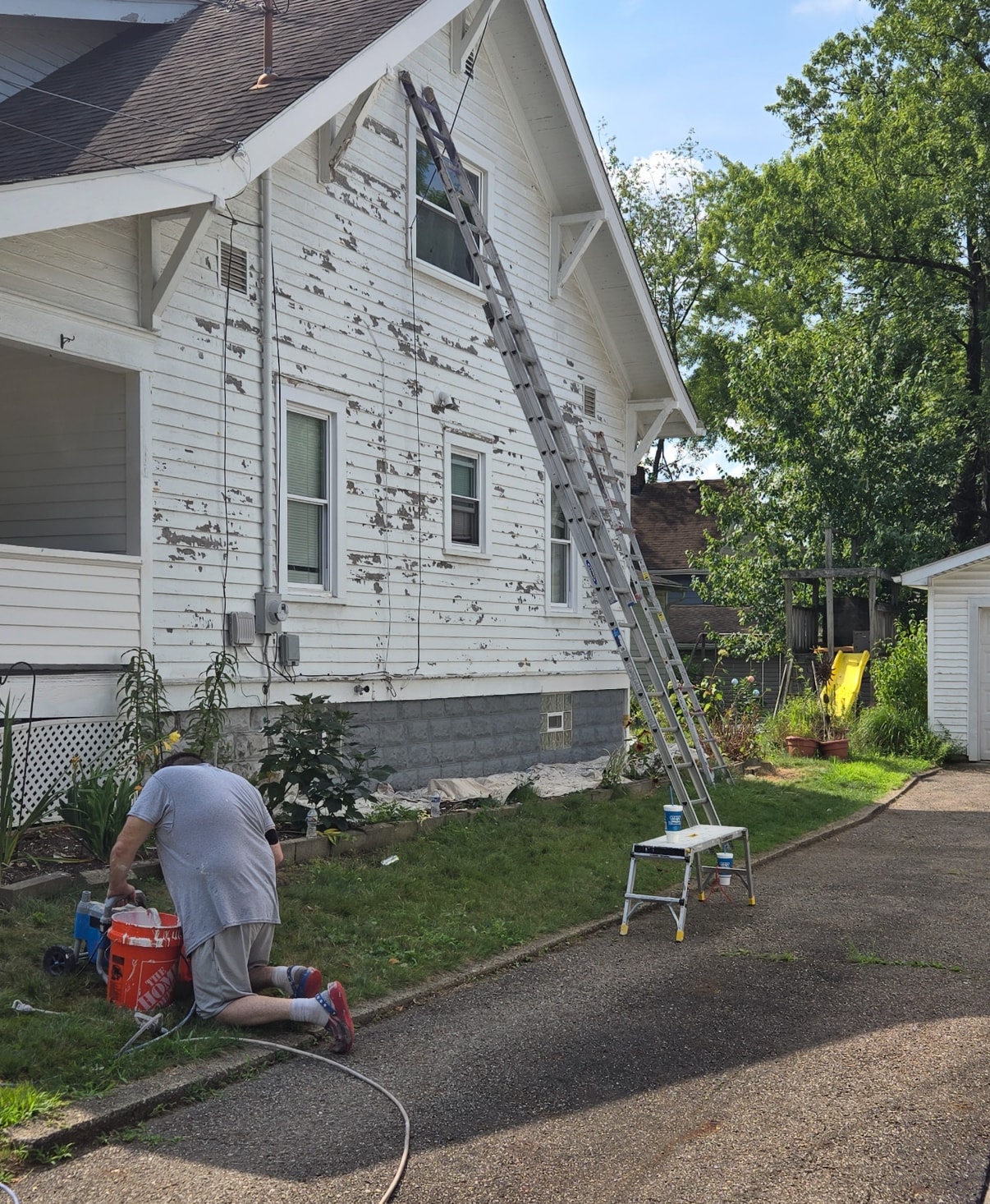 Before exterior house scraping in Akron Ohio — Akron painter scraping peeling paint, Akron painters exterior prep work