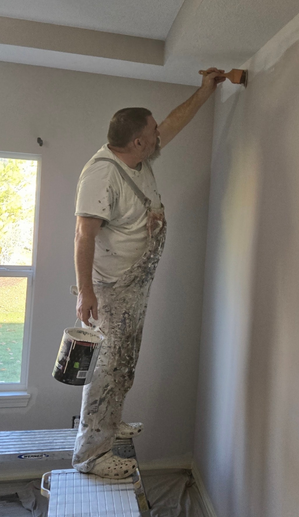 Jay the Akron painter on ladder cutting in wall paint — Kenmore Painters residential interior painting Akron Ohio