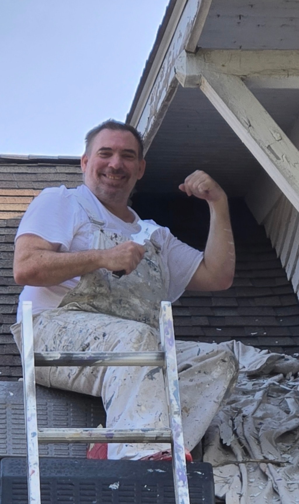 Jay the Akron painter flexing on a roof at a painting job — Kenmore Painters master painter Akron Ohio personality shot