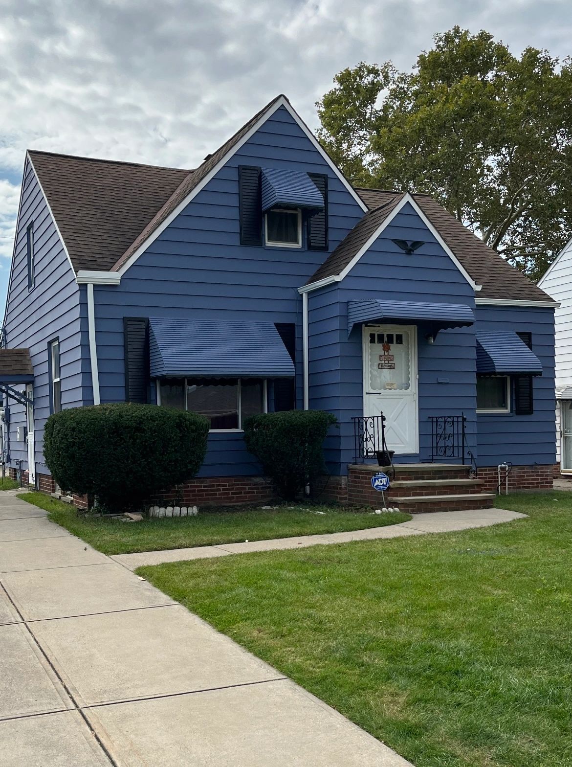 After - blue house exterior