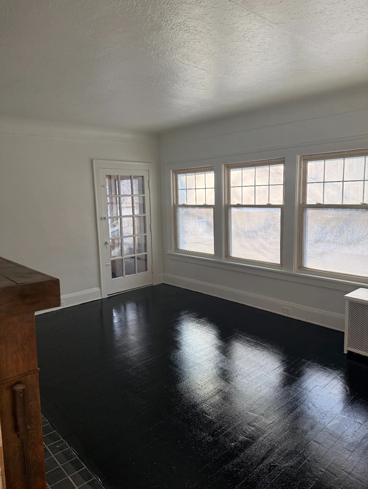 Interior room after — bright white freshly painted