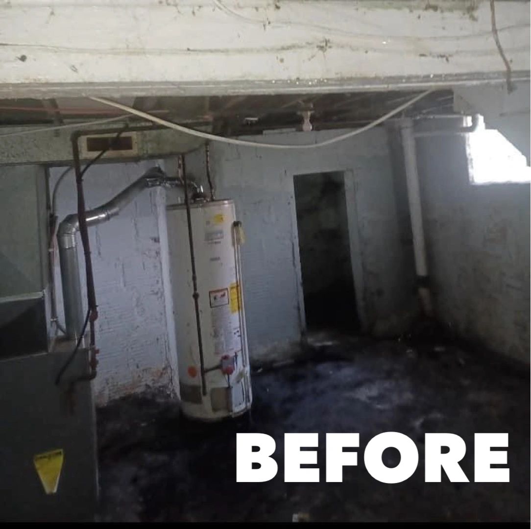 Basement before — cluttered utility room